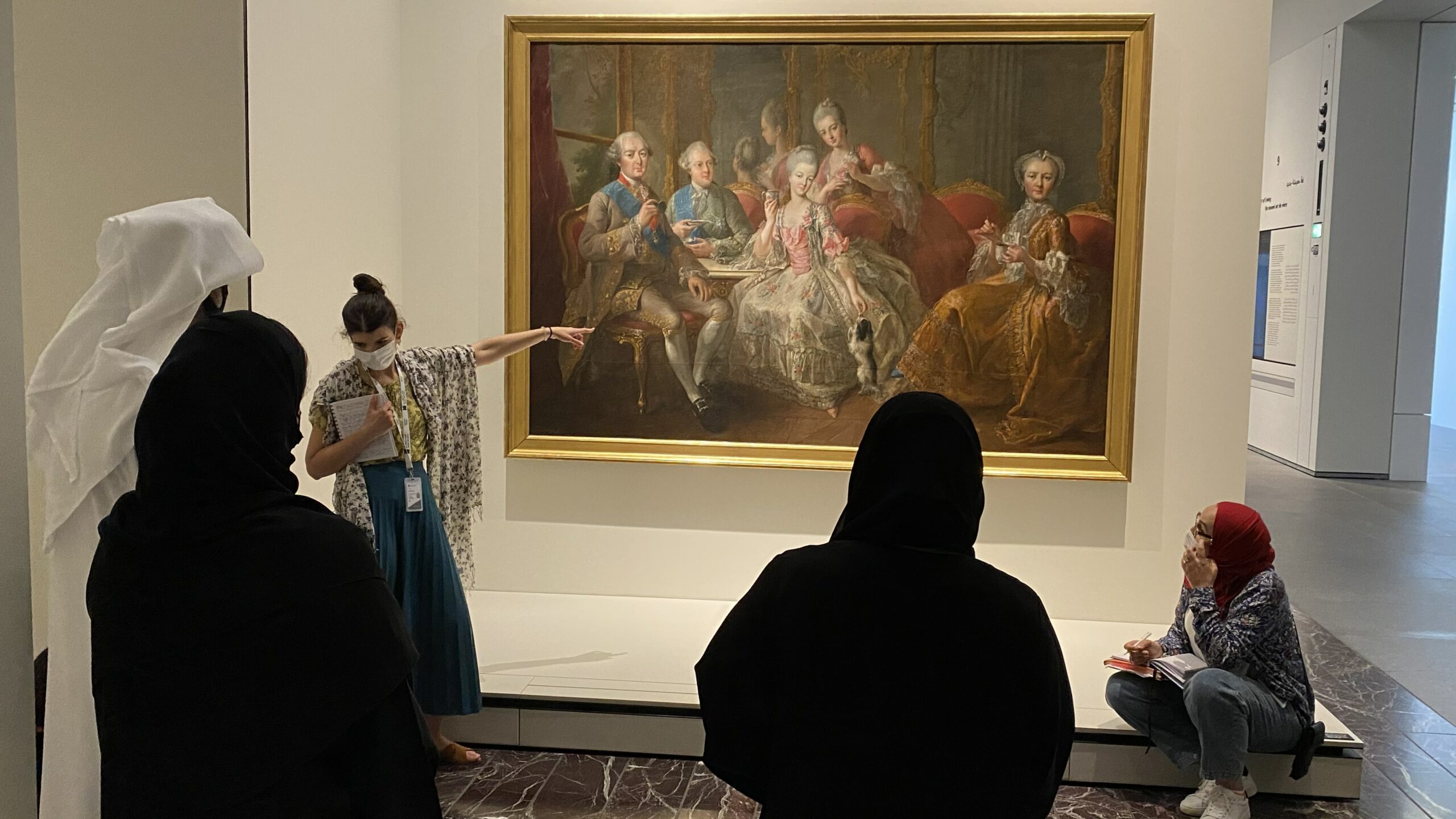 France Museums’ expert in mediation discussing over a painting with Louvre Abu Dhabi mediators Jean-Baptiste Charpentier, le Vieux, La Famille du duc de Penthièvre en 1768. Capacity Building page