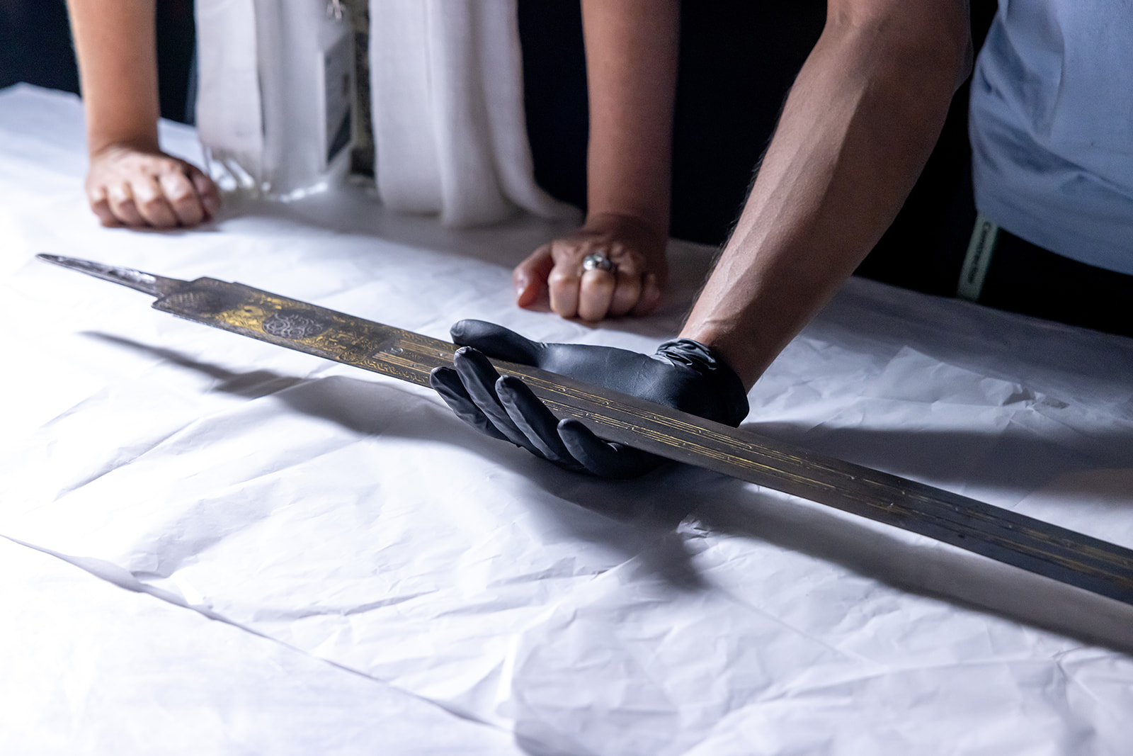 Examination of an artwork on the installation of the exhibition 